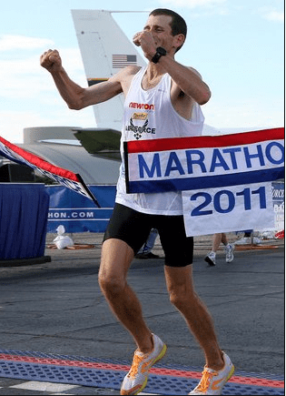 Dr. Mark Cucuzzella as he crosses the finish line to win the 2011 Air Force Marathon (for the second time!)